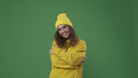 woman laughing over green background