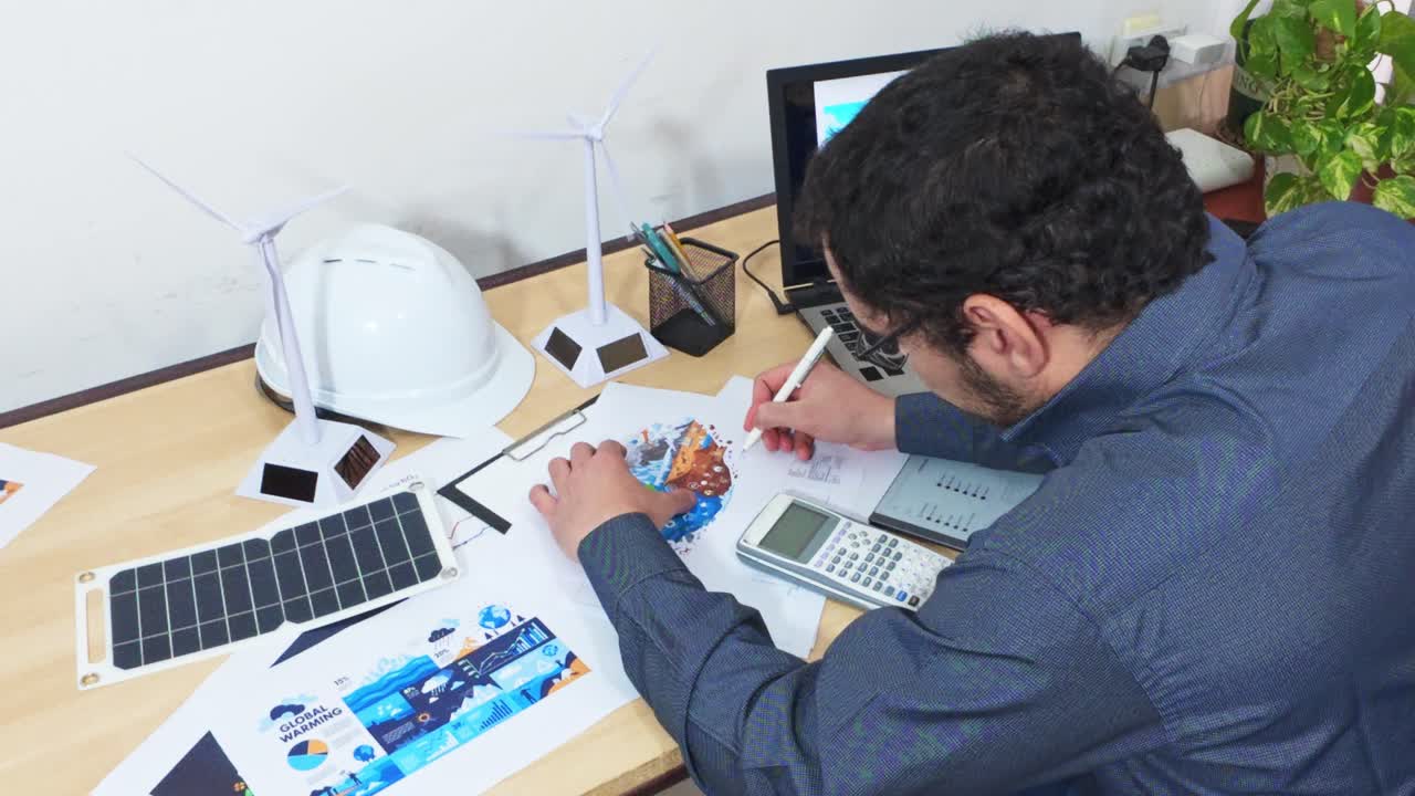 Artist and Engineer Illustrating the Impact of Climate Change