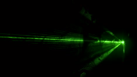 dust particles in green laser light beam from diffraction grating