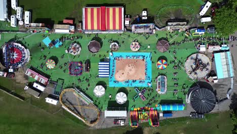 4k30p drone aerial view amusement park carnival carousel recreation playground