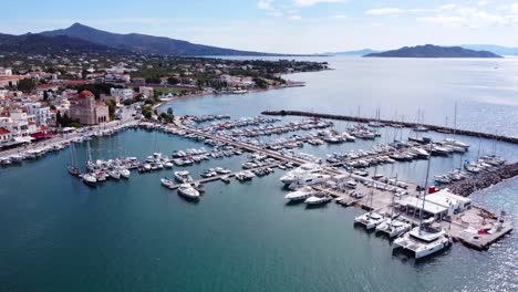 a blue view of yachts in the main marine at aegina island, saronic islands, greece