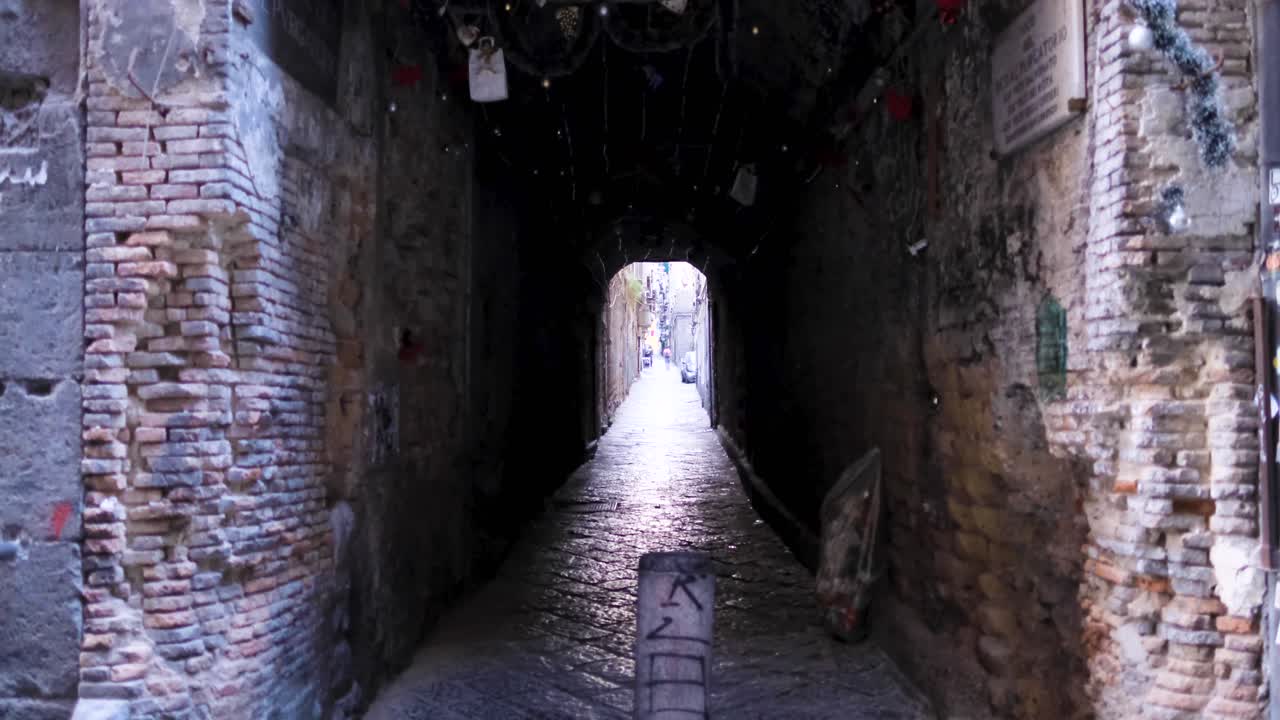 Slow Motion Rising Shot of Gritty Neapolitan Brick Tunnel with Rich Textures and Decorations