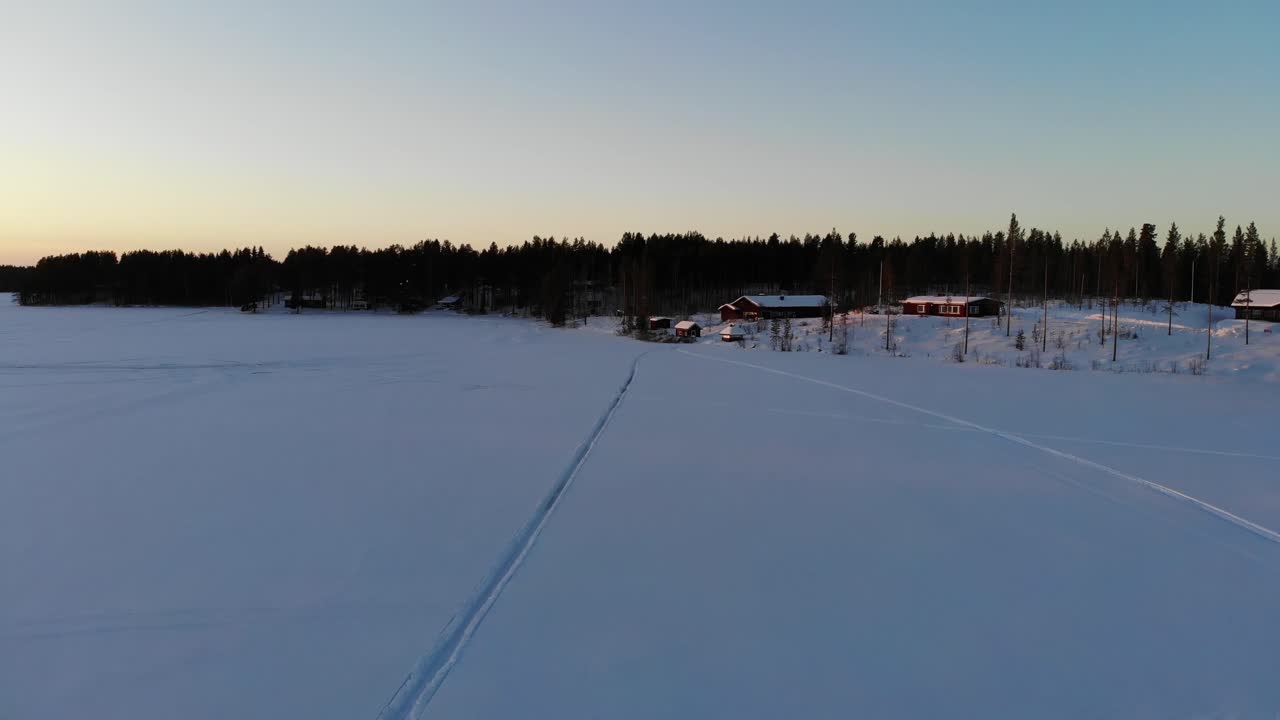 Frozen Kemijoki River In Rovaniemi, Finland - aerial drone shot