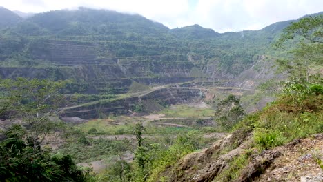 looking inside the huge cooper and gold mine pit at panguna mine on remote tropical island, autonomous region of bougainville, papua new guinea