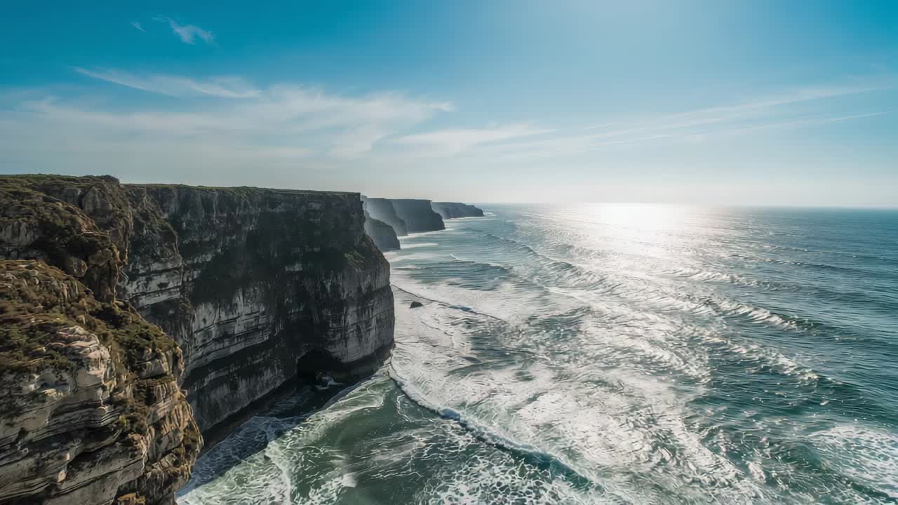 Launching drone flying along limestone cliffs, capturing sea cave and sun glare, copy space