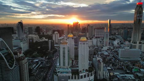 Bangkok Thailand's skyscrapers aerial sunset view of commercial area corporate road