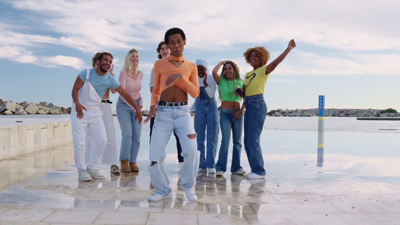 Group of friends dancing outdoors