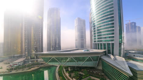 A-captivating-time-lapse-captures-the-dramatic-scene-of-fog-enveloping-the-skyscrapers-of-the-JLT-community-in-Dubai,-United-Arab-Emirates