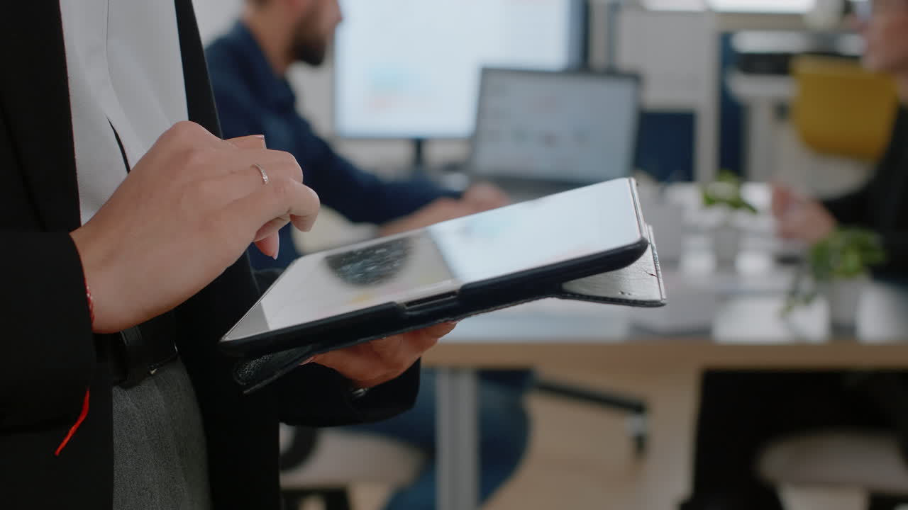 Close up of woman holding digital tablet with touch screen
