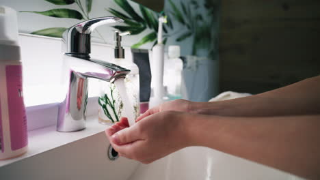 washing hands in a modern bathroom