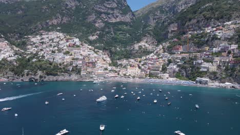 drone shot, push in revealing the whole town positano,italy