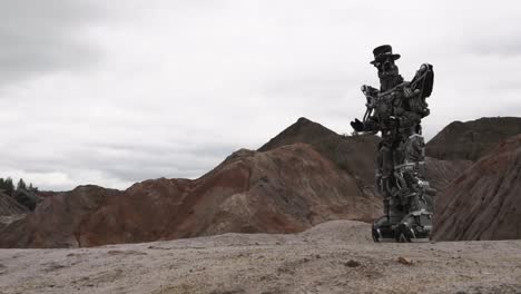 mechanical figure in a mountainous landscape