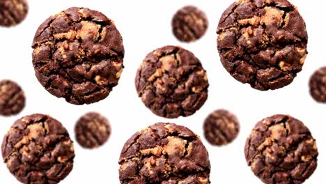 una corriente de galletas de chocolate de diferentes diámetros en un fondo de color blanco. imágenes 4k uhd. diseño futurista, diseño de movimiento animación. diseño de arte pop, concepto creativo de dulces de navidad