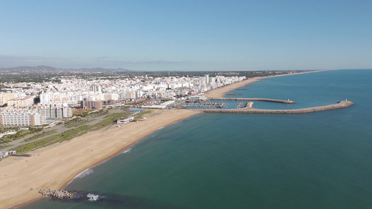 Drone footage capturing the coastline and beach scenery in Vilamoura, Algarve.
