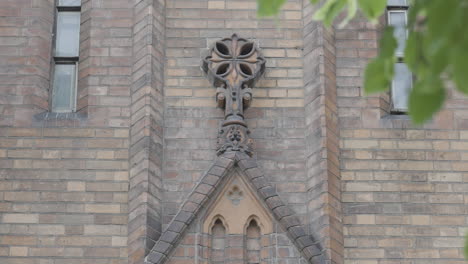 ornate architectural detail of a brick church wall