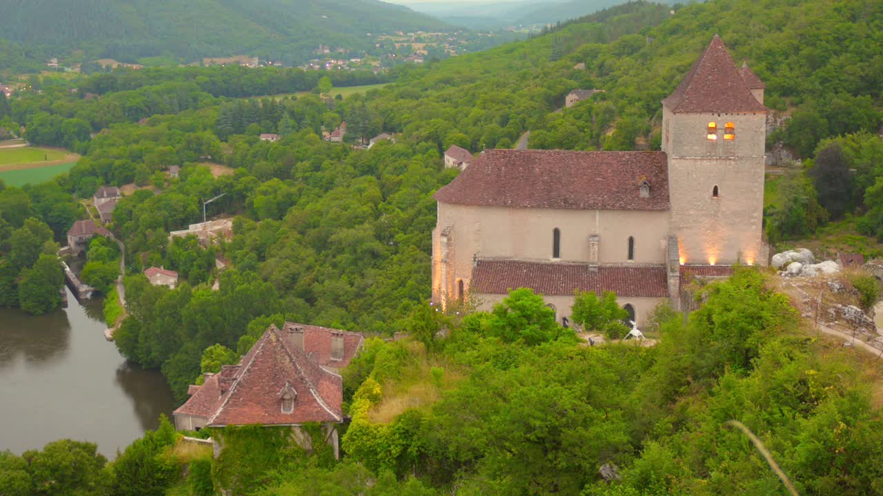 Scenic View Of Historic Church And Medieval Town Of Saint-Cirq-Lapopie In The Lot Valley, Midi-Pyrenees, France. Aerial Shot