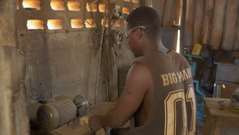 African-American-Worker-Sharpens-a-Metallic-Circular-Saw-at-Workplace-in-Africa