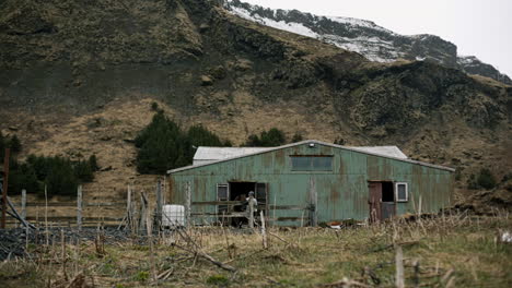 old rusty barn in icelandic mountains