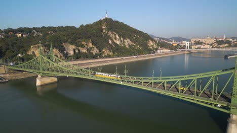 forward drone shot over budapest's liberty bridge