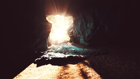 breathtaking scenery of bright sun rays falling inside a cave illuminating