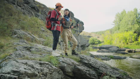 asian female tourists walking on river bank