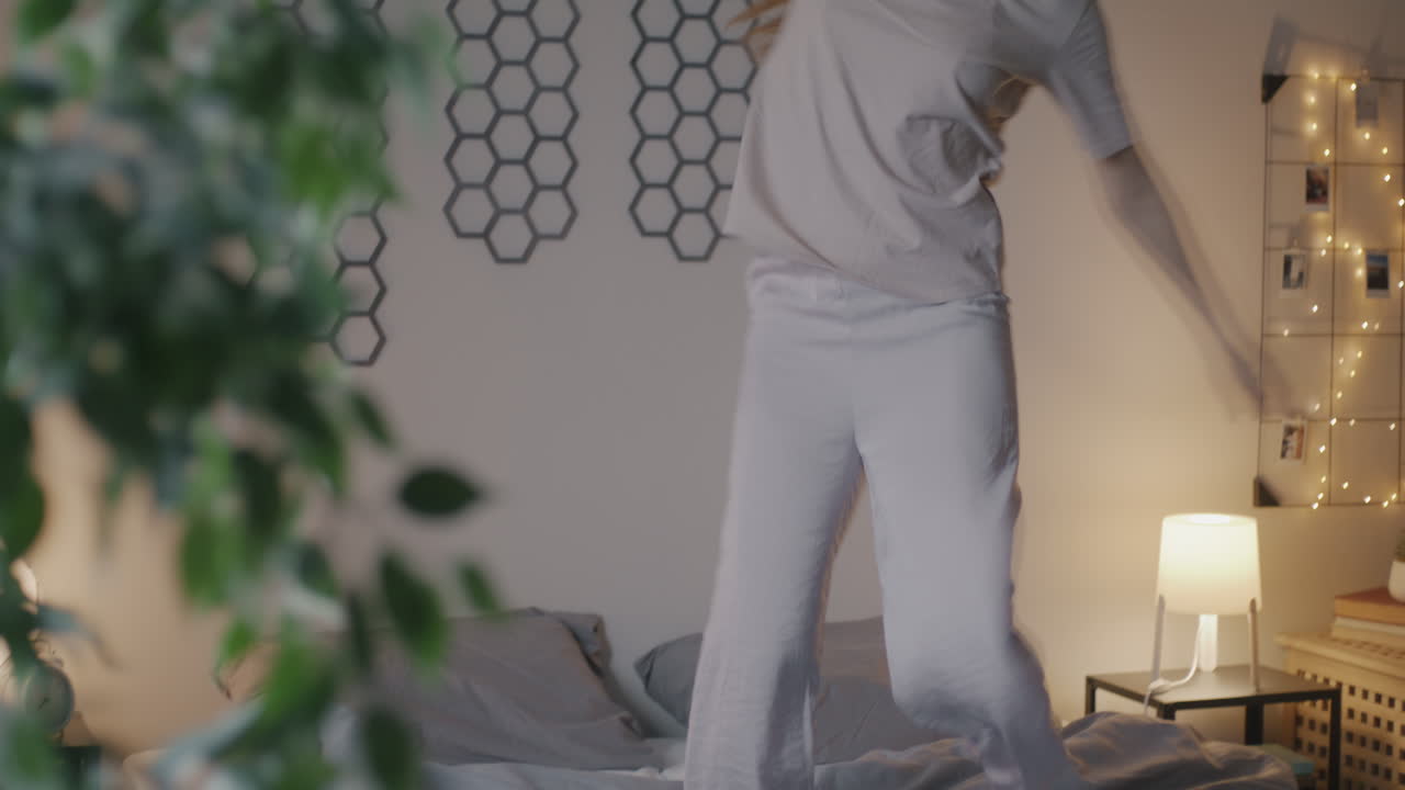 Happy Woman Dancing in Pajamas at Home