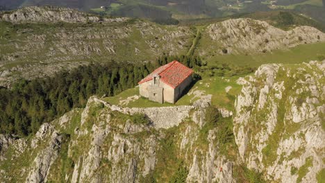 Aerial-drone-view-of-the-hermitage-of-Santa-Eufemia-on-the-top-of-a-mountain-in-Aulestia-in-the-Basque-Country