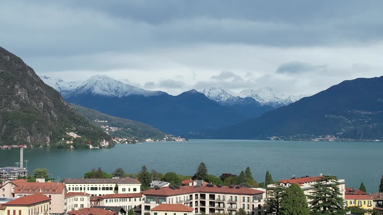 Stunning aerial view of the Italian Alps with lake and town scenery
