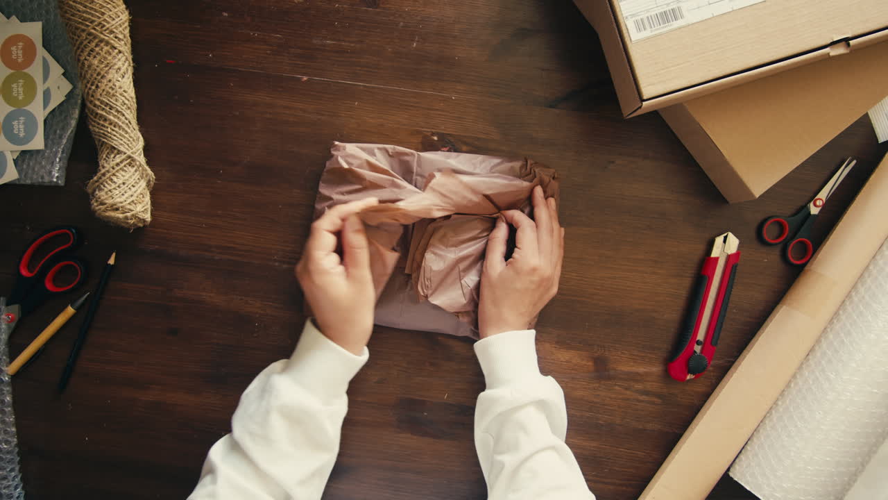 E-commerce storage shop, woman packing goods and clothes for second hand delivery market, dedicated Packaging and Shipping Workspace with Supplies and Technology for efficiency, online sales.