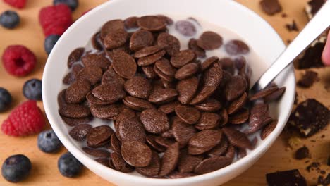 stirring a bowl of chocolate cereal