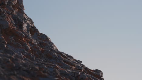 A-close-up-view-of-the-rocky-dolomite-stone-formations-of-the-Trollholmsund-beach-in-Norway