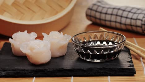 rose shaped steamed dumplings with soy sauce