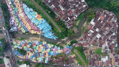 Scenic-aerial-top-view-of-colorful-houses-of-Jodipan-village,-Java,-Indonesia