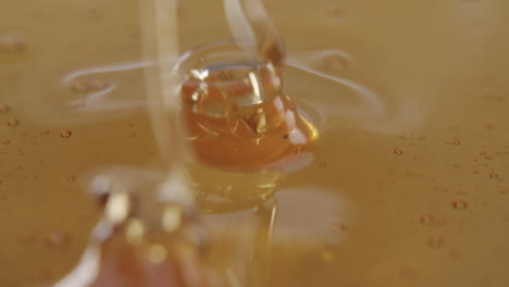 close up shot of a surface filled with honey