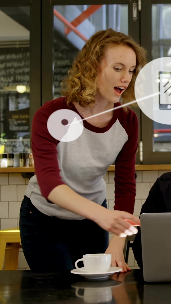 Placing cup maroon shirt cafe worker at counter leaning tapping laptop helping client icons growing