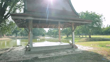 Sala-Thai-Pavilion-in-a-Green-Historical-Park-in-Ayutthaya-with-a-Lake