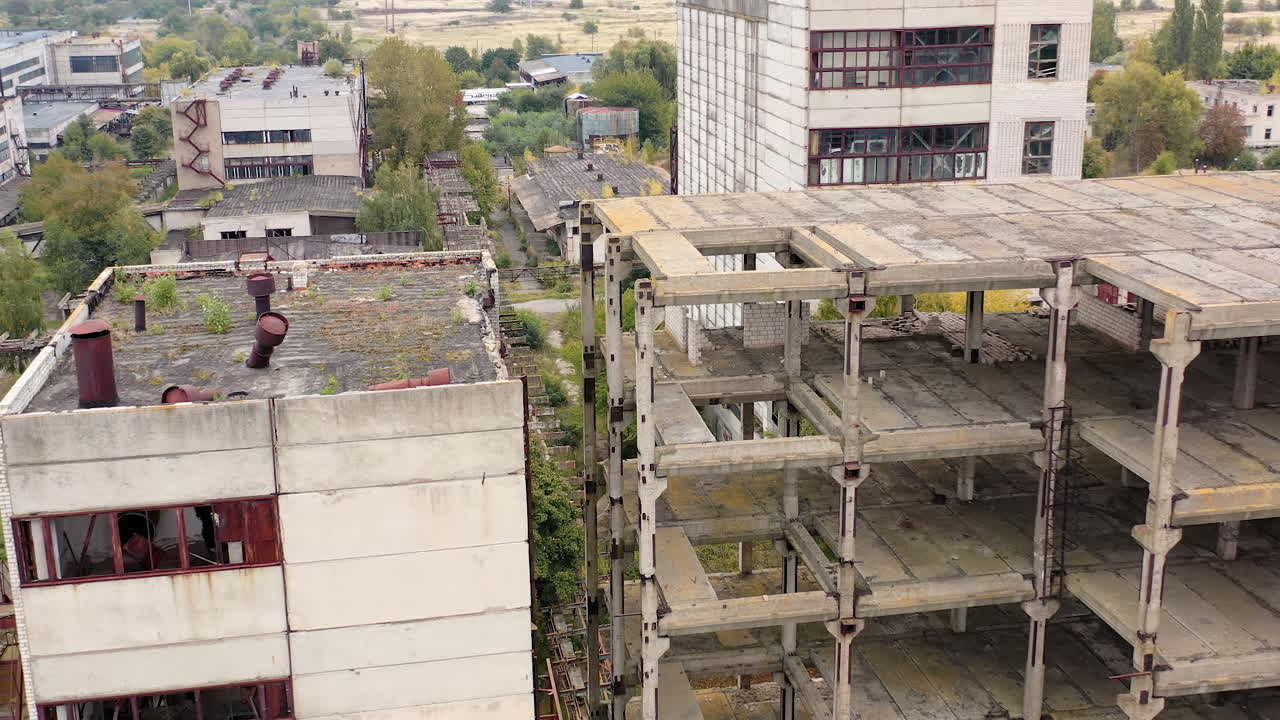 Industrial destroyed city buildings. Abandoned ruined factory building architecture.