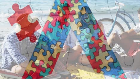 Animation-of-colourful-puzzle-pieces-ribbon-over-happy-friends-at-summer-beach-party