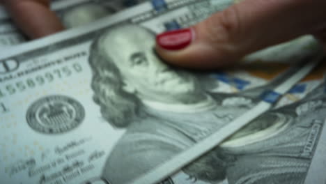 business woman counting cash money. woman holding one hundred dollar bills