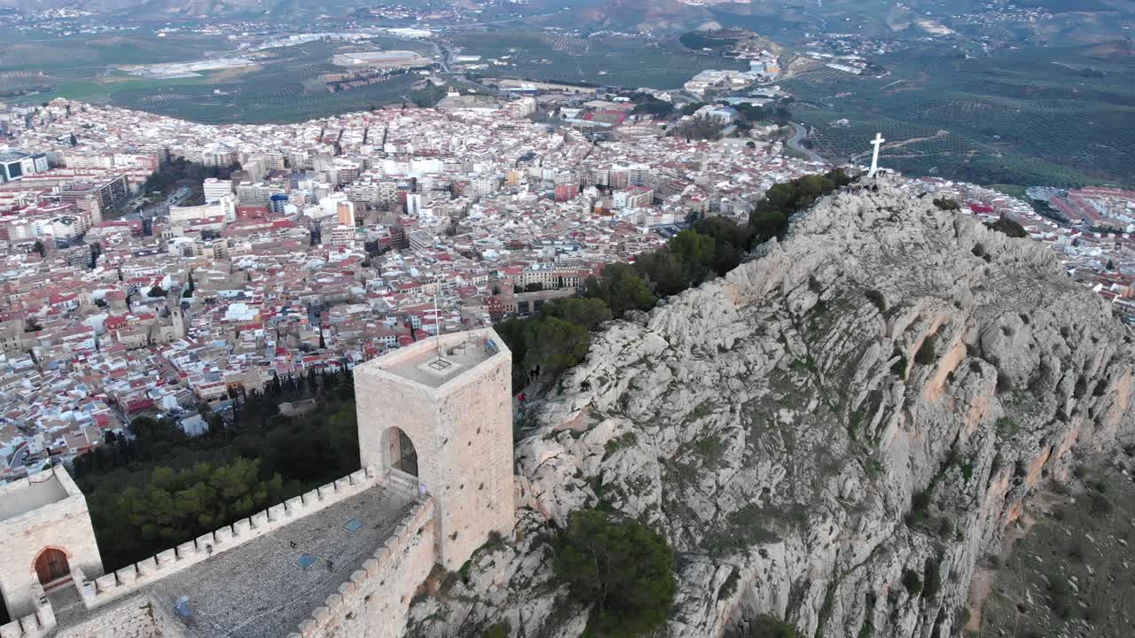 Jaen's Castle Saint Catalina Castle Spain shoot with a drone at 4k 24fps showing the exterior and the city from multiple points on a afternoon in December.