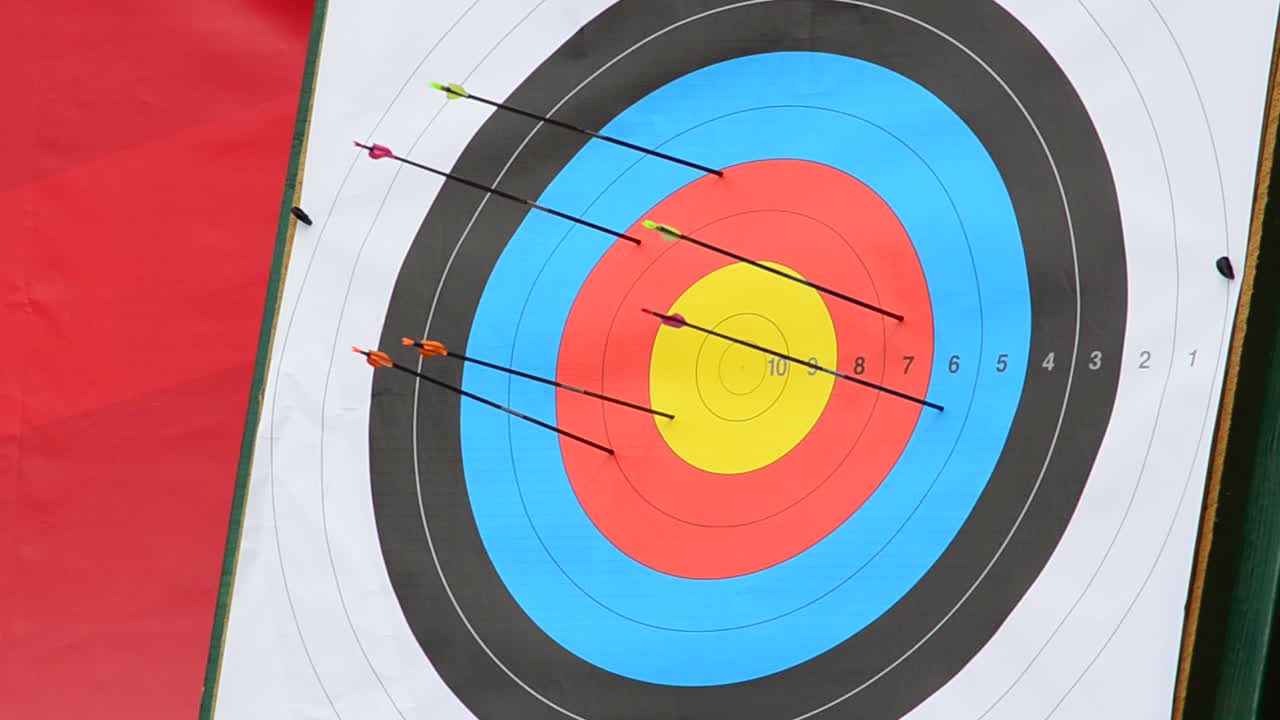 Arrows Sticking in a Colorful Archery Target with High Scores