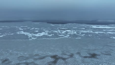 pamoramic and scenic view a large area of the lake is frozen in winter