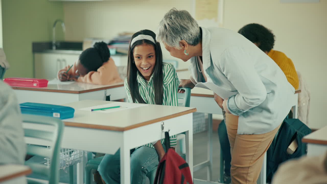 Teacher interacting with student in classroom