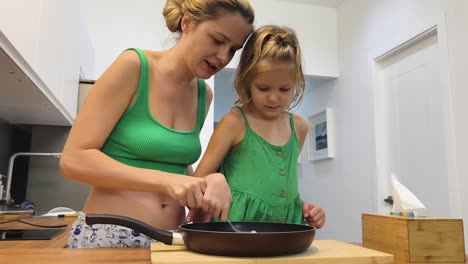 mother and daughter cooking together