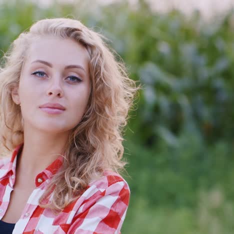 portrait of farmer against the background of a corn field