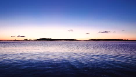 blue and orange sunrise over lake video 4k