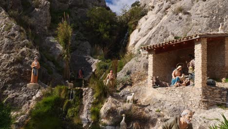 human sized nativity scene next to a creek in jijona, spain