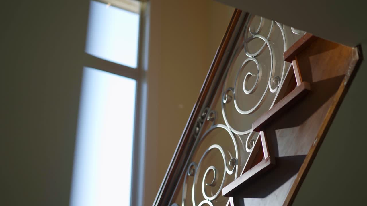 A cinematic shot of elegant staircases with a creative elegant design in a luxury home