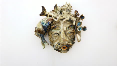 portrait shot of a skulpture made of things out of the atlantic ocean