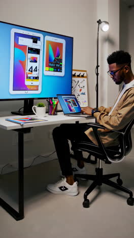 man working on computers